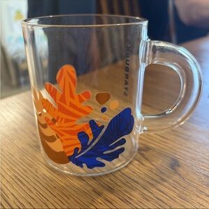 Starbucks Glass Mug with Orange and Blue Leaf Design